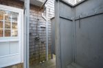 Large enclosed hot outdoor shower with private changing area 